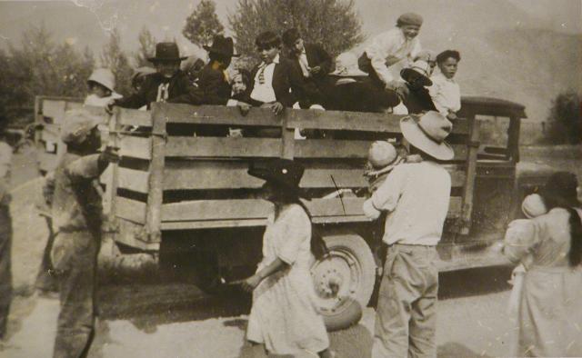 Children being rounded up in a cattle truck.